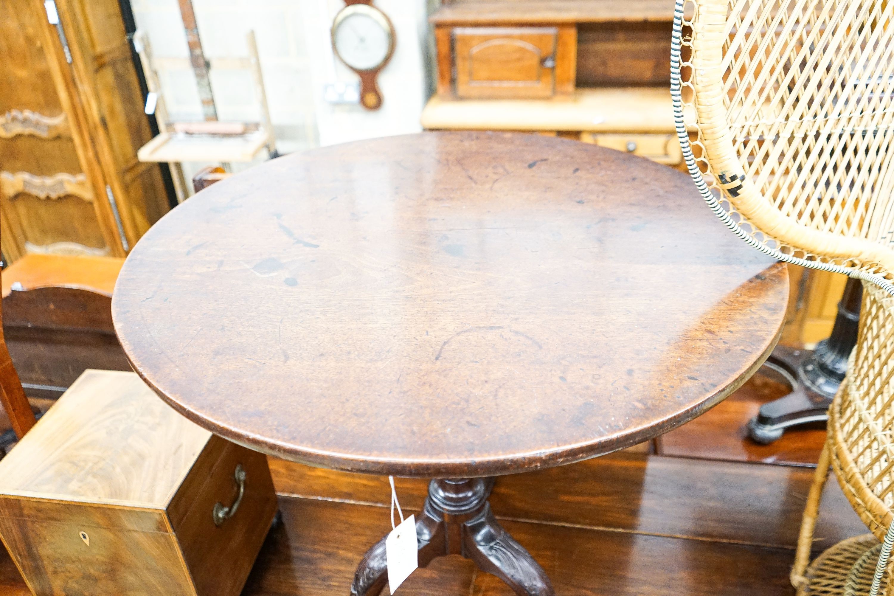 A George III carved mahogany circular birdcage tilt top tripod tea table, diameter 77cm, height 71cm